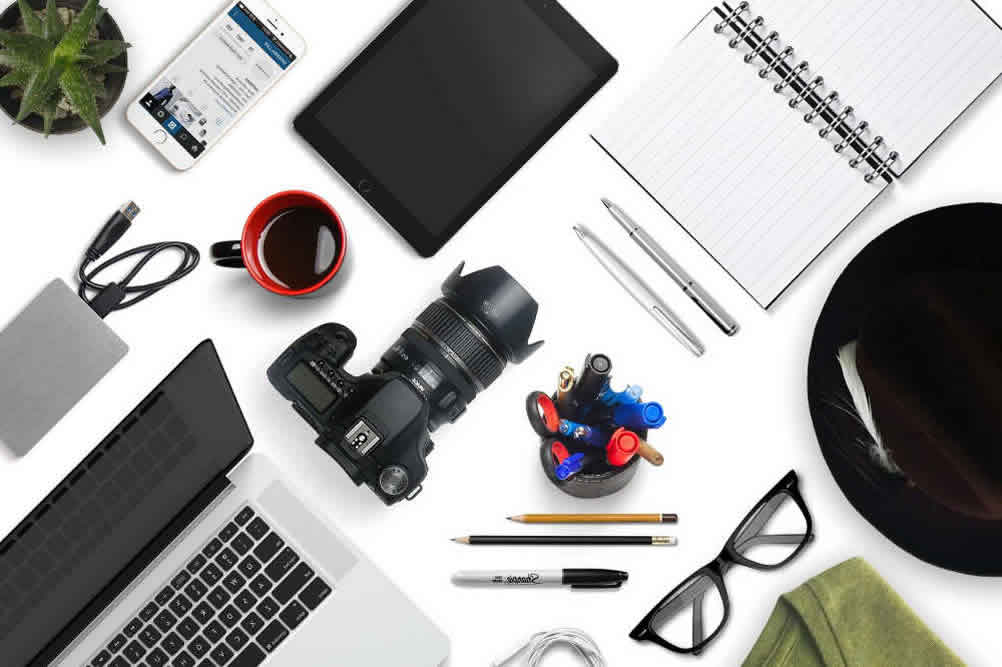 photograph of various cameras, laptops, tablets etc.